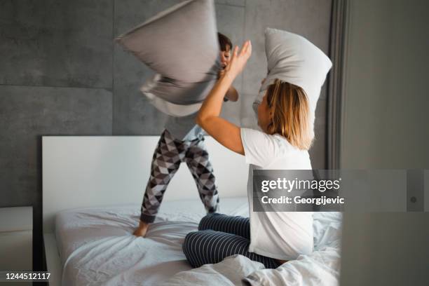 pillow fight - pillow fight stock pictures, royalty-free photos & images
