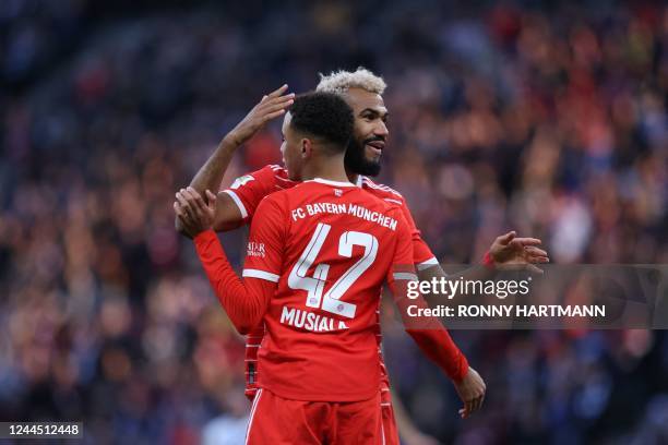 Bayern Munich's German midfielder Jamal Musiala celebrates with Bayern Munich's Cameroonian forward Eric Maxim Choupo-Moting after scoring the 0-1...