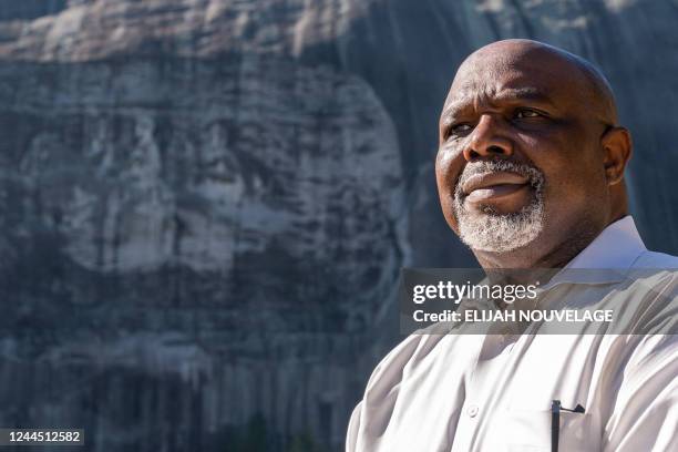 Lance Hammonds, President of the NAACP DeKalb branch, poses for a portrait in front of the Confederate Memorial Carving at Stone Mountain Park on...