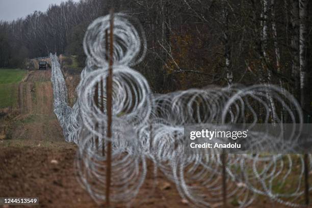 View of the ongoing construction of the new barbed wire fence between Poland and the Russian exclave Kaliningrad border on November 05, 2022 in...