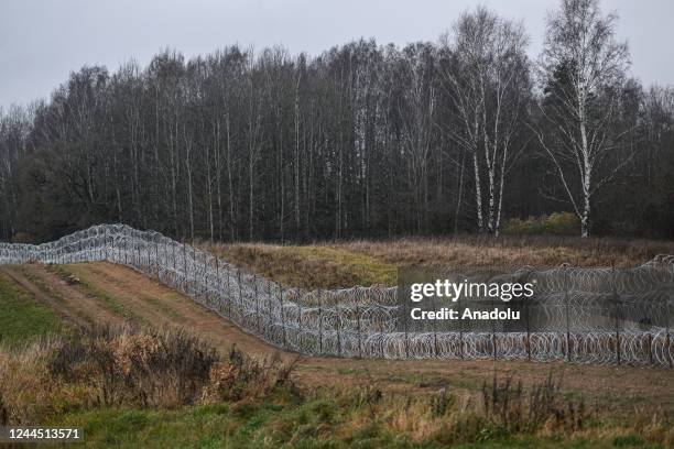 View of the ongoing construction of the new barbed wire fence between Poland and the Russian exclave Kaliningrad border on November 05, 2022 in...