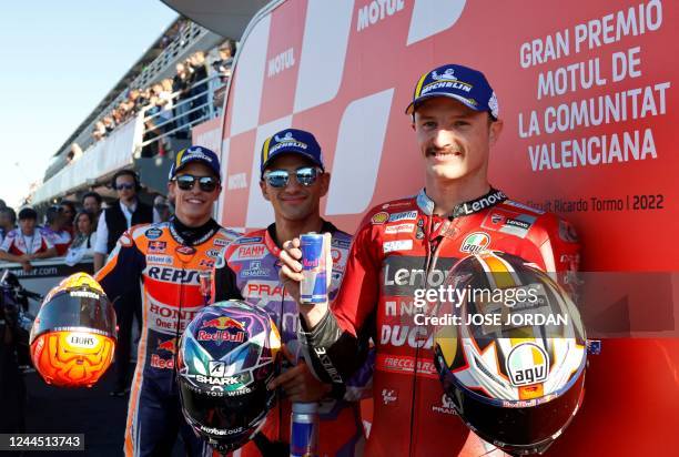 Pramac Racing Spanish rider Jorge Martin celebrates after taking the pole position next to second placed Repsol Honda Team Spanish rider Marc Marquez...