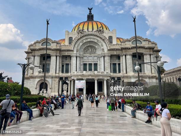 People visit the surroundings of the Palacio de Bellas Artes in Mexico City on November 4, 2022.