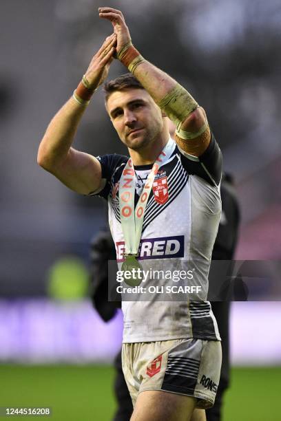 Man of the match England's Tommy Makinson applauds the fans after the 2021 rugby league World Cup men's Quarter Final match between England and Papua...