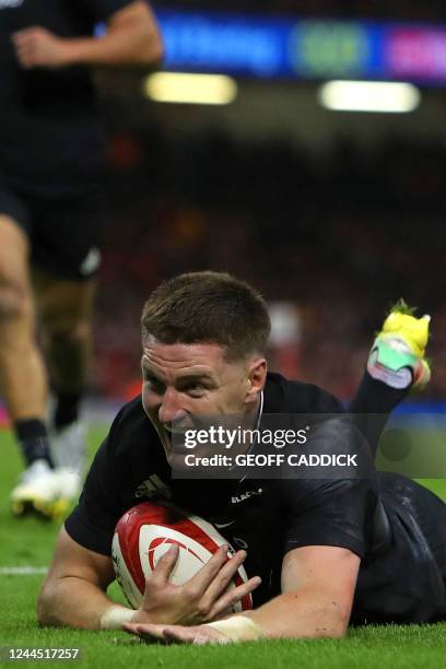 New Zealand's centre Jordie Barrett dives over the line to score a try during the Autumn International rugby union match between Wales and New...