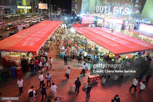 People visit a night market on June 3, 2020 in Hohhot, Inner Mongolia Autonomous Region of China.