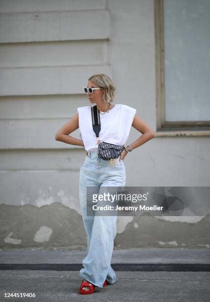 Karin Teigl wearing Chanel sandals, Closed jeans, Monki shirt and Dior bag on May 31, 2020 in Augsburg, Germany.