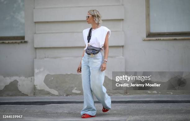 Karin Teigl wearing Chanel sandals, Closed jeans, Monki shirt and Dior bag on May 31, 2020 in Augsburg, Germany.