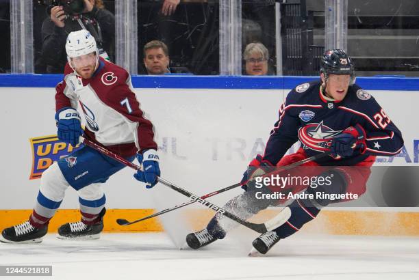 Devon Toews of the Colorado Avalanche and Patrik Laine of the Columbus Blue Jackets look for the loose puck during the 2022 NHL Global Series Finland...
