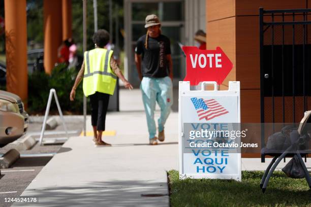 Voters wait in line cast their ballots at the C. Blythe Andrews, Jr. Public Library polling precinct during early voting on November 5, 2022 in...