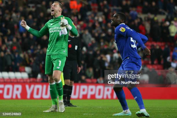 Cardiff City Goalkeeper Ryan Allsop and Cardiff City's Niels Nkounkou celebrate at full time during the Sky Bet Championship match between Sunderland...