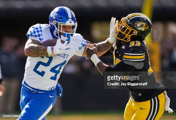 Chris Rodriguez Jr. #24 of the Kentucky Wildcats stiff arms Chad Bailey of the Missouri Tigers during the second half at Faurot Field/Memorial...