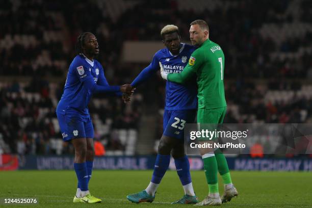 Cardiff City's Romaine Sawyers and Cardiff City Goalkeeper Ryan Allsop pull Cardiff City's Cédric Kipré away from a confrontation during the Sky Bet...