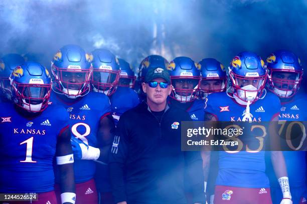 Head coach Lance Leipold of the Kansas Jayhawks stands with his team as they wait to take to the field prior to a game against the Oklahoma State...