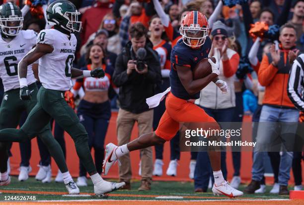 Shawn Miller of the Illinois Fighting Illini runs for a touchdown during the first half against the Michigan State Spartans at Memorial Stadium on...