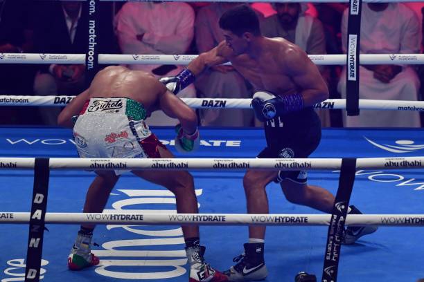 Dmitry Bivol competes with Gilberto Ramirez during their WBA Light-Heavyweight World Title boxing match at the Etihad Arena in Abu Dhabi on November...