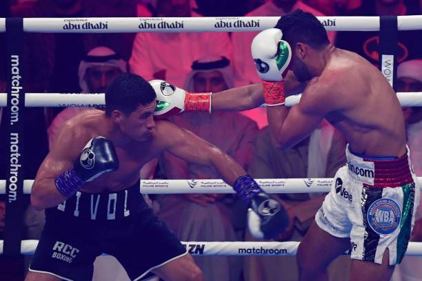 Dmitry Bivol competes with Gilberto Ramirez during their WBA Light-Heavyweight World Title boxing match at the Etihad Arena in Abu Dhabi on November...