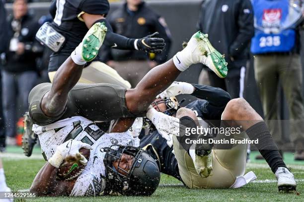 Running back Noah Whittington of the Oregon Ducks falls into the end zone with a third quarter touchdown against the Colorado Buffaloes during a game...
