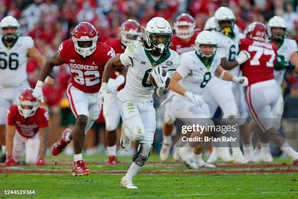 Running back Craig Williams of the Baylor Bears finds an opening for a 43-yard run on third and three against the Oklahoma Sooners but stops short of...