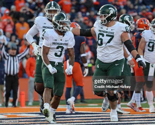 Jarek Broussard of the Michigan State Spartans celebrates with J.D. Duplain of the Michigan State Spartans during the second half] against the...