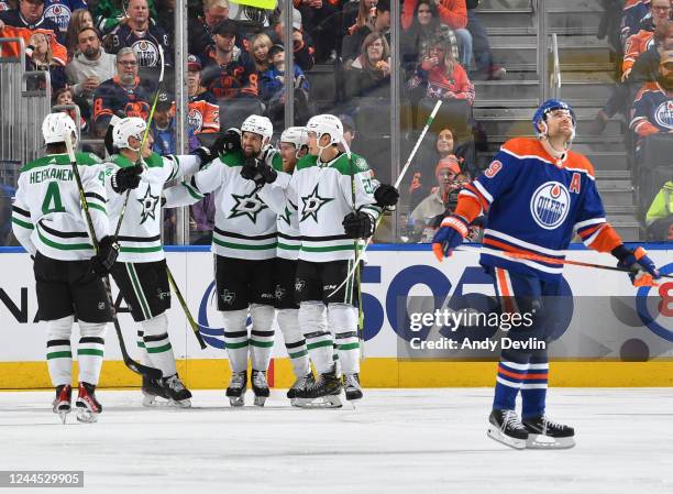 Jamie Benn of the Dallas Stars celebrates his third period goal against the Edmonton Oilers with Miro Heiskanen, Jason Robertson, and Roope Hintz...