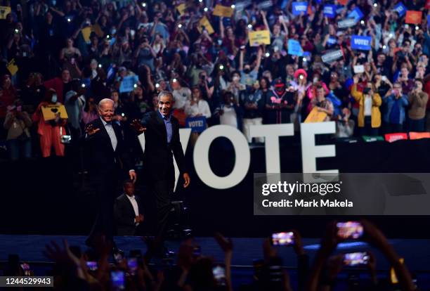 Former U.S. President Barack Obama and President Joe Biden wave to supporters during a rally for Pennsylvania Democratic Senate nominee John...