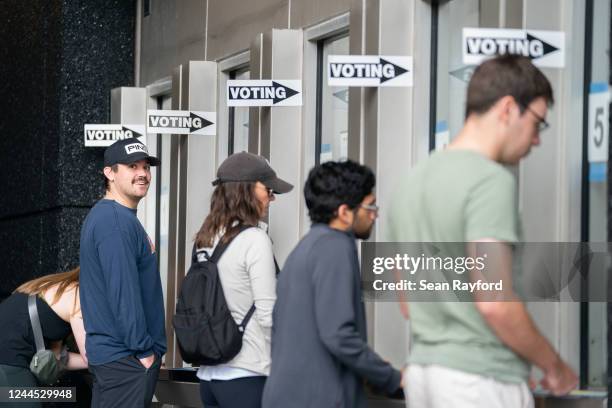 People check in for early voting at a polling location at Bank of America Stadium on November 5, 2022 in Charlotte, North Carolina. Today marked the...