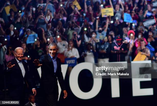 Former U.S. President Barack Obama and President Joe Biden wave to supporters during a rally for Pennsylvania Democratic Senate nominee John...