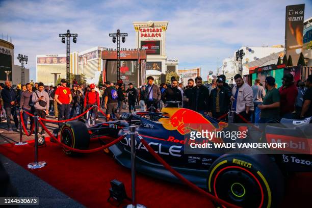 Attendees view a Formula 1 racing team car from Oracle Red Bull Racing during the Formula 1 Las Vegas Grand Prix Launch Party at Caesars Palace, in...