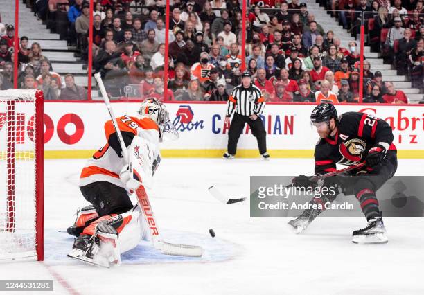 Claude Giroux of the Ottawa Senators scores his 300th career NHL goal against Carter Hart of the Philadelphia Flyers at Canadian Tire Centre on...