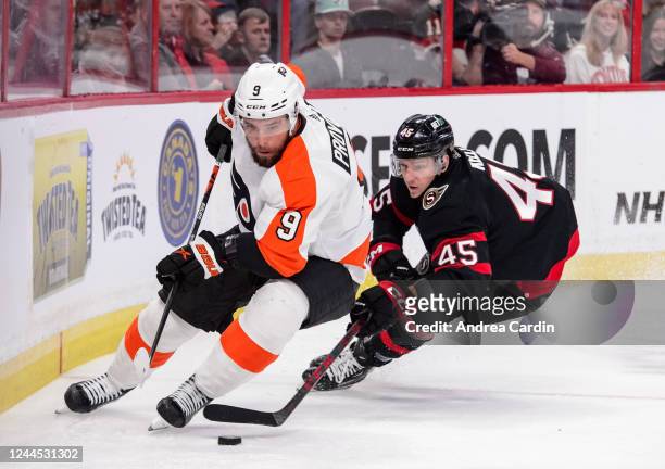 Ivan Provorov of the Philadelphia Flyers controls the puck against Parker Kelly of the Ottawa Senators at Canadian Tire Centre on November 5, 2022 in...