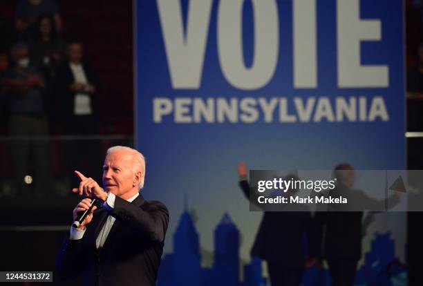 President Joe Biden addresses supporters as former President Barack and Obama and Democratic gubernatorial nominee Josh Shapiro walk off stage during...