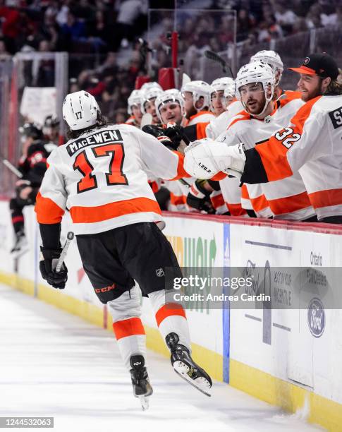 Zack MacEwen of Philadelphia Flyers celebrates his second period goal against the Ottawa Senators with teammates at the players bench at Canadian...