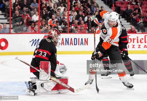 Cam Talbot of the Ottawa Senators makes a save against Scott Laughton of the Philadelphia Flyers at Canadian Tire Centre on November 5, 2022 in...