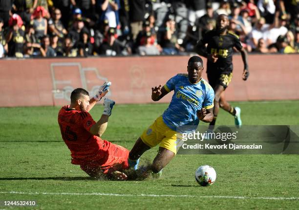 Goalkeeper Maxime Crépeau of Los Angeles FC collides with Cory Burke of Philadelphia Union in extra time during the 2022 MLS Cup Final at Banc of...