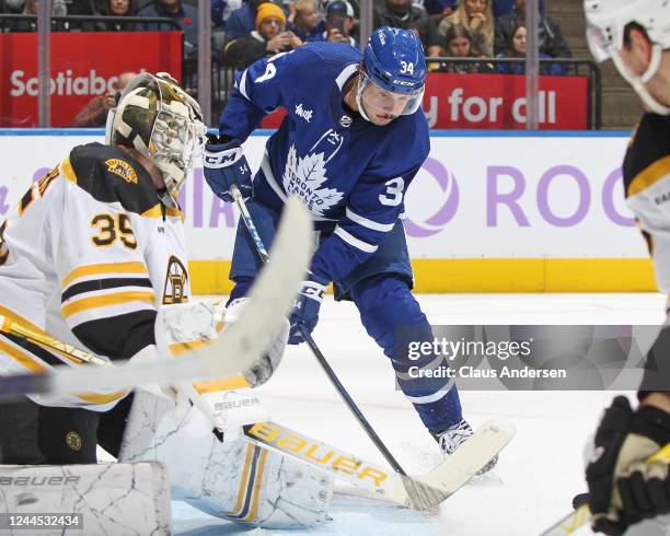 Auston Matthews of the Toronto Maple Leafs gets a puck past Linus Ullmark of the Boston Bruins during an NHL game at Scotiabank Arena on November 5,...