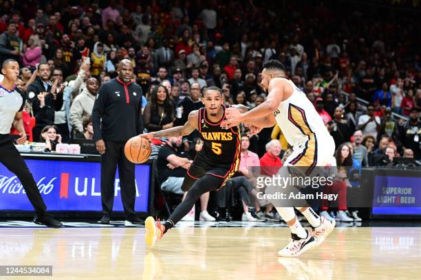 Dejounte Murray of the Atlanta Hawks dribbles the ball during the game against the New Orleans Pelicans on November 5, 2022 at State Farm Arena in...