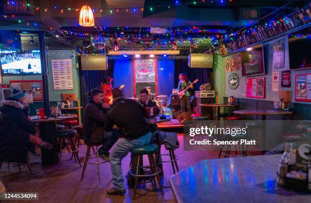 People listen to live music on November 05, 2022 in Anchorage, Alaska. Early and absentee voting has begun in Alaska for the decisive midterm...