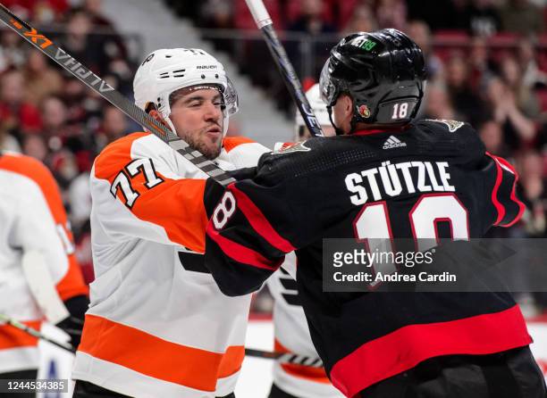 Tim Stützle of the Ottawa Senators pushes Tony DeAngelo of the Philadelphia Flyers during the third period at Canadian Tire Centre on November 5,...