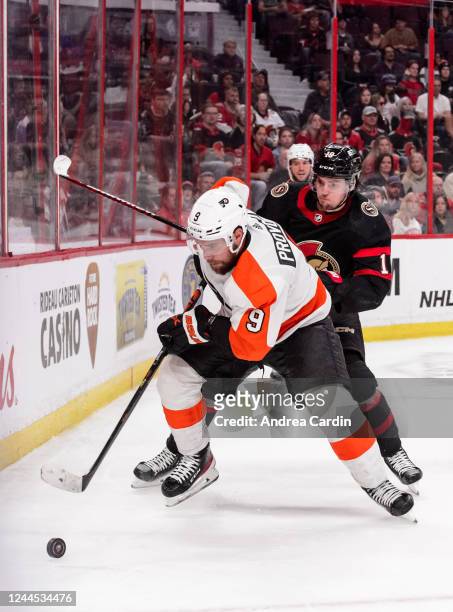 Drake Batherson of the Ottawa Senators battles for puck possession against Ivan Provorov of the Philadelphia Flyers at Canadian Tire Centre on...