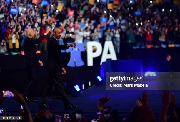 Former U.S. President Barack Obama and President Joe Biden arrive on stage to rally for Pennsylvania Democratic Senate nominee John Fetterman and...