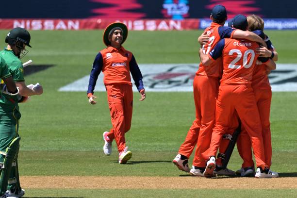 Netherlands' players celebrate their win during the ICC men's Twenty20 World Cup 2022 cricket match between Netherlands and South Africa at Adelaide...