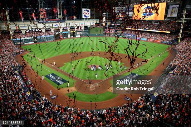 Members of the Houston Astros celebrate on the field after the Astros defeated the Philadelphia Phillies in Game 6 to clinch the 2022 World Series at...