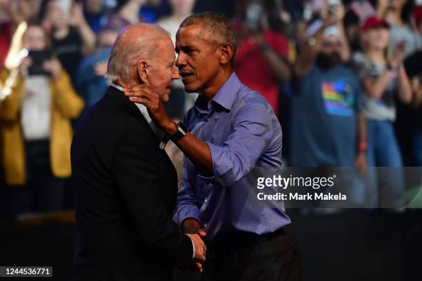 President Joe Biden and former U.S. President Barack Obama embrace on stage during a rally for Pennsylvania Democratic Senate nominee John Fetterman...