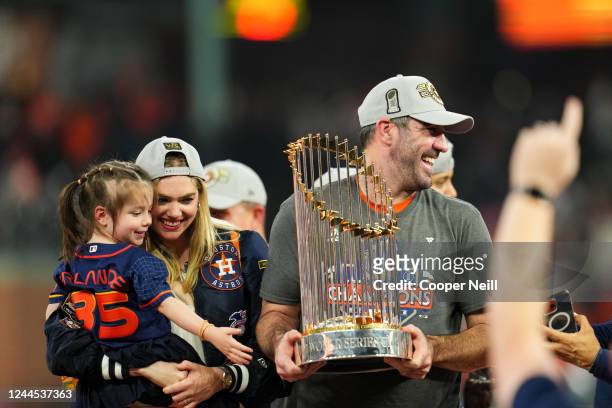 Justin Verlander of the Houston Astros holds the Commissioners Trophy after the Astros took Game 6 against the Philadelphia Phillies to win the 2022...