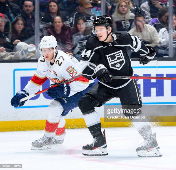 Eetu Luostarinen of the Florida Panthers and Mikey Anderson of the Los Angeles Kings battle for position during the second period at Crypto.com Arena...