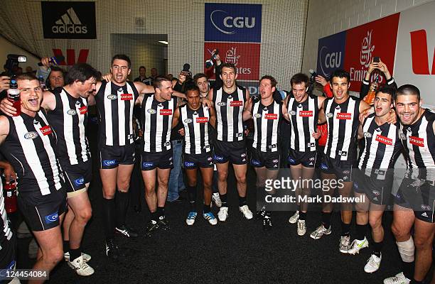 Collingwood players sing the team song after winning the AFL First Qualifying match between the Collingwood Magpies and the West Coast Eagles at...