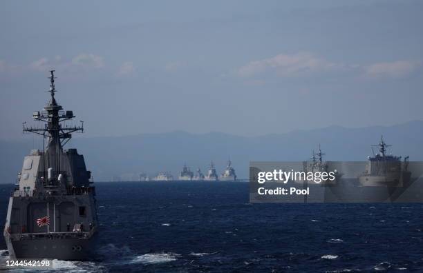 The Japan Maritime Self-Defense Force destroyer Shiranui and other naval vessels participate in an International Fleet Review commemorating the 70th...