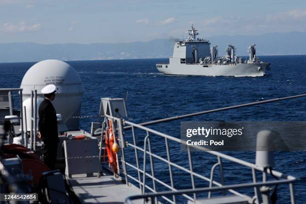 The Republic of Korea Navy ship ROKS Soyang sails near the Japan Maritime Self-Defence Force destroyer Izumo during an International Fleet Review...