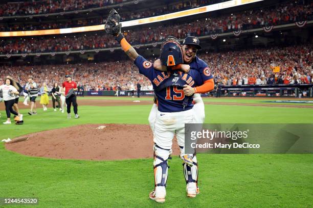 Christian Vázquez and Martín Maldonado of the Houston Astros celebrate after the Houston Astros defeated the Phillies, 4-1, in Game 6 of the 2022...